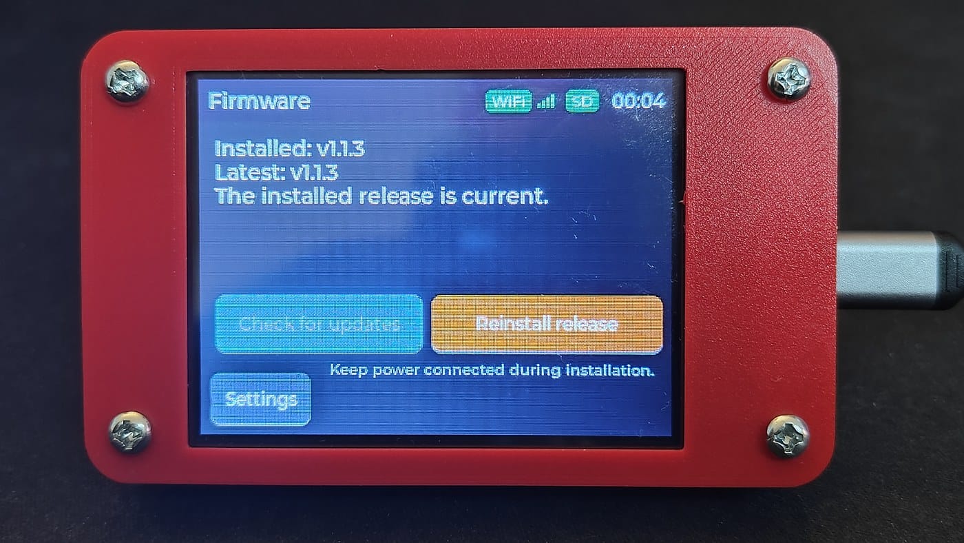 The CYD firmware screen showing version 1.1.3 installed and marked current