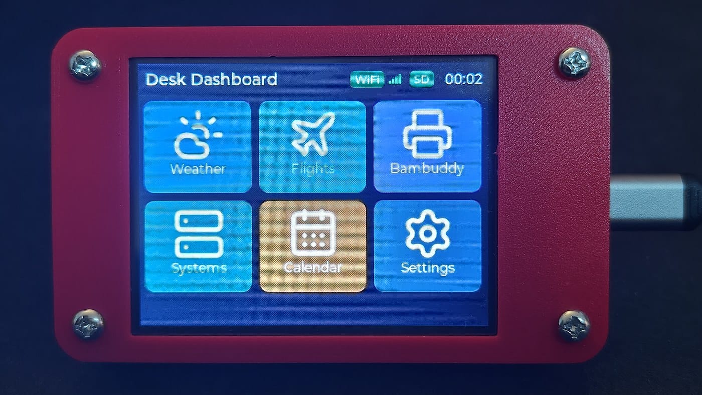 The CYD Desk Dashboard home screen on the physical ESP32 touchscreen