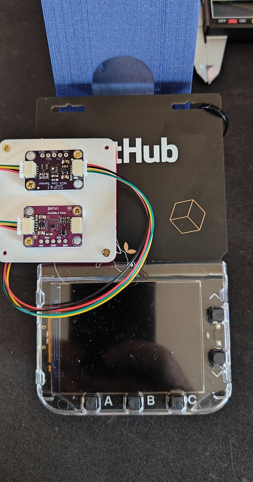 First oversized sensor platform positioned on the badge and obscuring part of the GitHub branding